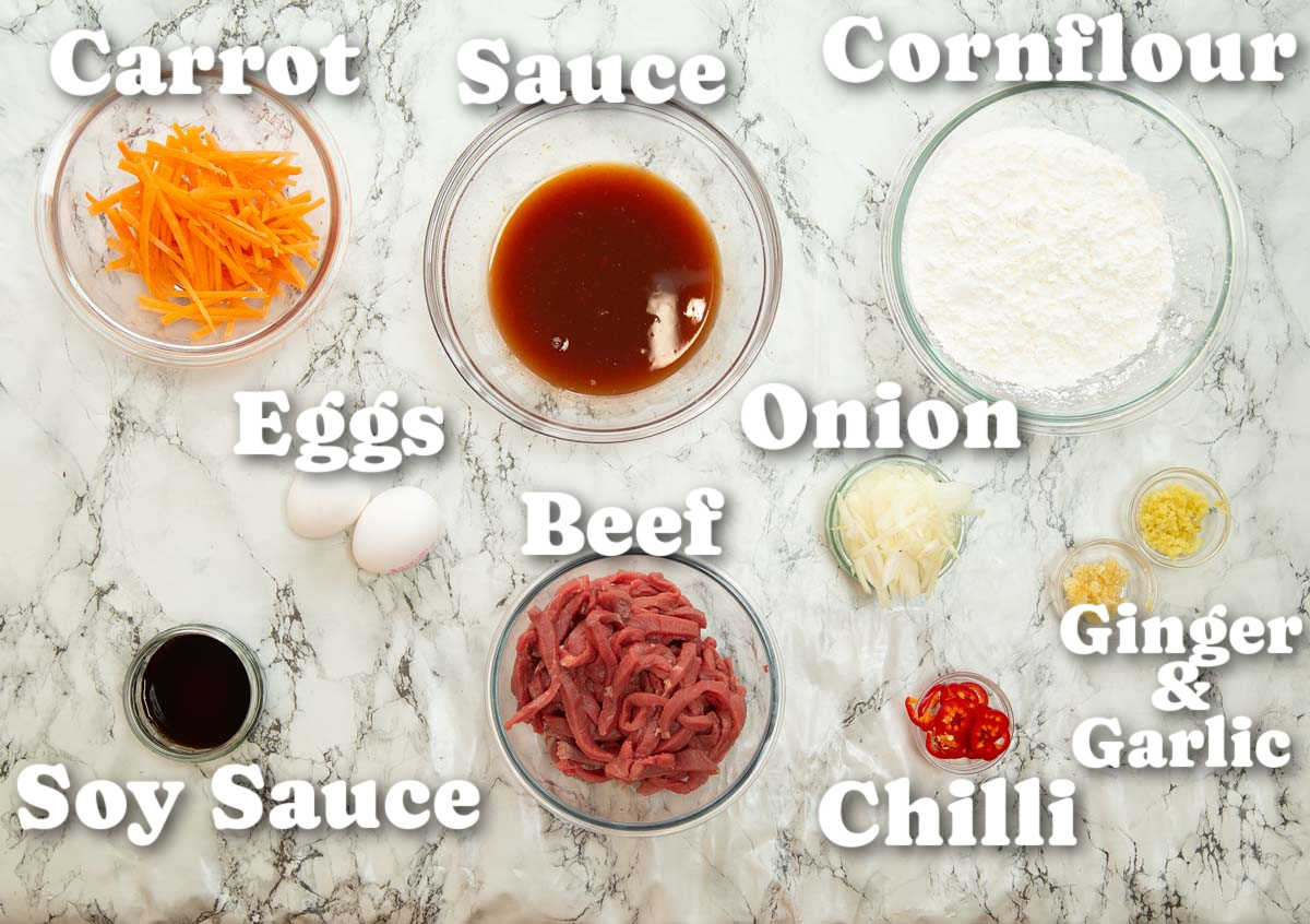 overhead shot of crispy chilli beef ingredients with text labels