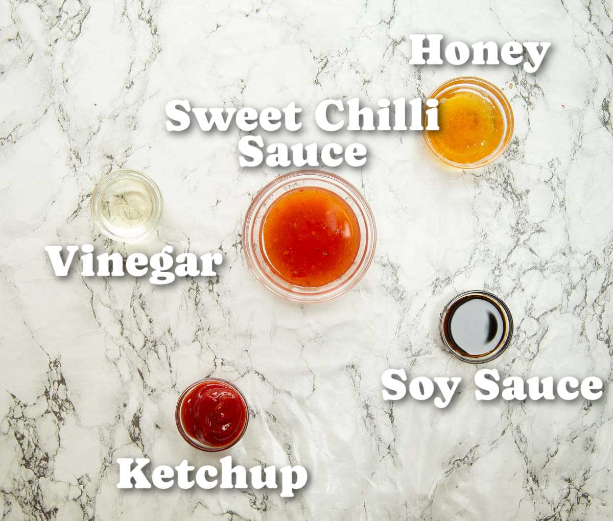 overhead shot of crispy chilli beef sauce ingredients with text labels